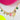 Necklace with colorful charms on a pink and white background