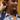Woman wearing a star-shaped earring with a blurred background