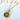 Gold necklace with a round pendant featuring a character design on a white background with text.