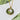 Green Opal Gems on Gold Locket Necklace with Floating Charms on white background
