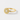 A gold ring featuring a round halo design with a central oval gemstone surrounded by small round stones, set on a plain light gray background.